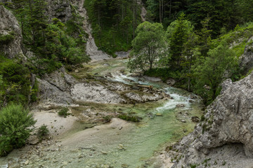 A valley between mountains with a small river