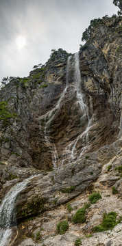 High waterfall with rocks around