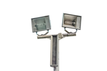 Electric spotlight pole on the street with blue cloudy sky background