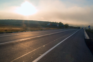 Obraz na płótnie Canvas Route A-270 in the area of Novoshakhtinsk in the early morning in the fog.