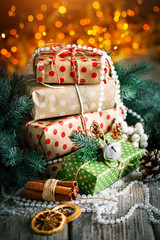 Merry Christmas and happy New year. Christmas gift and Christmas tree on dark wooden background....