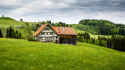 Obraz premium Bauern / Farmhaus in den Schweizer Alpen