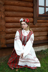 Girl posing in traditional Belarusian clothes