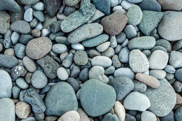 abstract background with dry round peeble stones. Sea stone close up