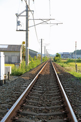 Fototapeta na wymiar 鉄道の線路と稲穂
