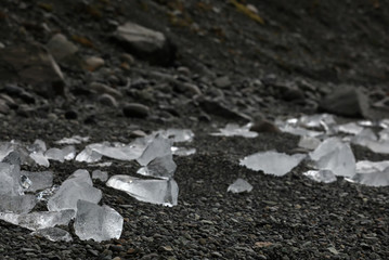 Chunks of ice on black ground. Diamond beach, Iceland