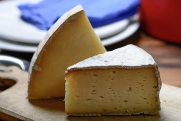 Pieces of French Tomme and Cantal cheese, close up