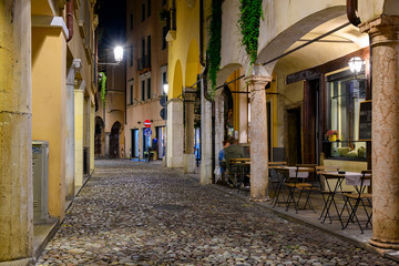 Fototapeta na wymiar Night view of narrow street in Padua (Padova), Veneto, Italy