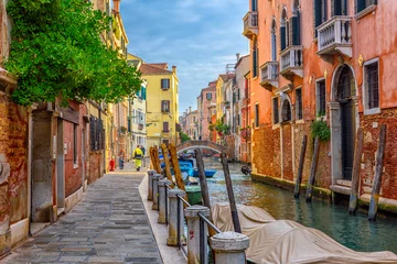 Fotobehang Narrow canal with bridge in Venice, Italy. Architecture and landmark of Venice. Cozy cityscape of Venice. © Ekaterina Belova