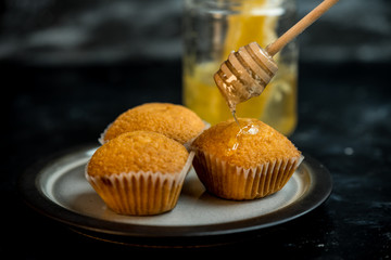 lemon muffins topped with golden honey