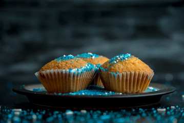 lemon muffins sprinkled with blue and white sprinkles
