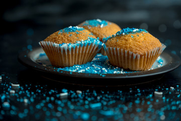 lemon muffins sprinkled with blue and white sprinkles