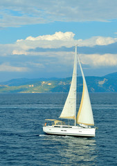 Fototapeta premium Antipaxos coast a yacht sailing in the Ionian sea