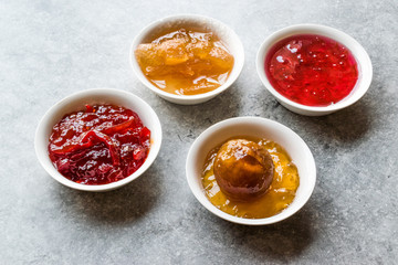 Assorted Variety of Jams and Marmalades;  Rose, Red Pepper, Mandarin and Citron Peel in Small Bowl.