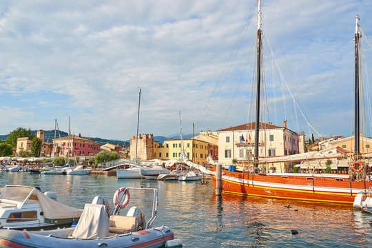 Harbor of city of "Bardolino" with colorful boats at Lake Garda in Italy