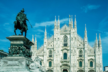 Fototapeta na wymiar Milan Cathedral (Duomo di Milano) and Vittorio Emanuele II equestrian statue at Cathedral square of Milan, Lombardy, Italy. Famous tourist attraction of Milan, Italy.