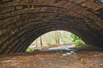 Fototapeta na wymiar Detail of a skewed arch stone bridge in Western Pennsylvania.