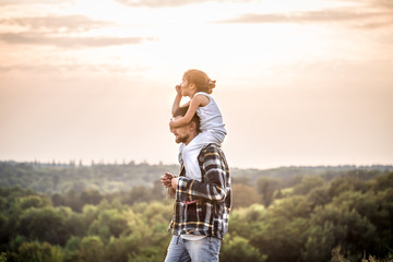 father and daughter at sunset, family values