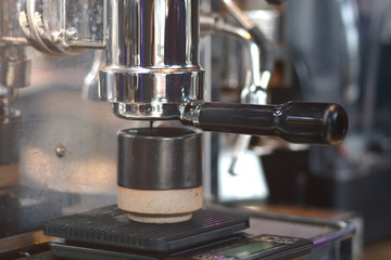 Barista prepares cappuccino in coffee shop