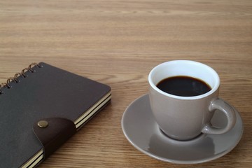 Fototapeta na wymiar A cup of coffee on working table.