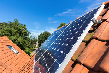 Row of solar panels  on roof at home