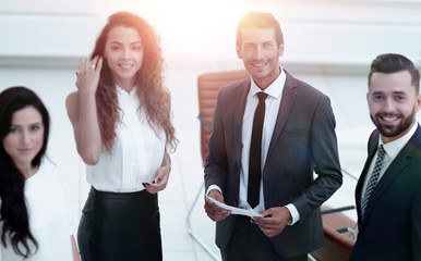 employees standing in a modern office