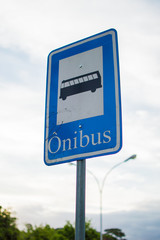 blue bus sign seen from close up