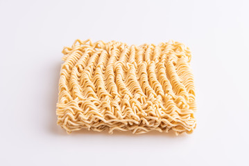 Dry uncooked instant noodles isolated in white background, top view, copy space, soft light