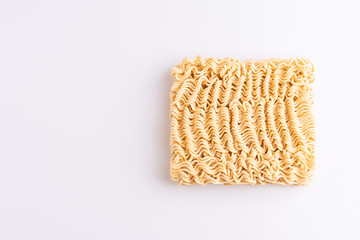 Dry uncooked instant noodles isolated in white background, top view, copy space, soft light