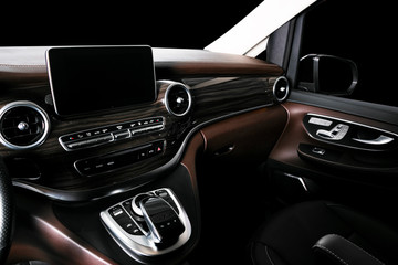 Modern Luxury car inside. Interior of prestige car. Comfortable leather seats. Brown perforated...