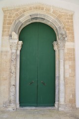 Green door to Church Saint Lucia at the Sepulcher at Piazza Saint Lucia in Syracuse, Sicily Italy 