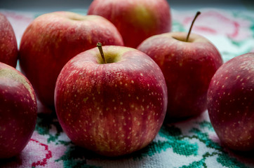 red apples on wooden table