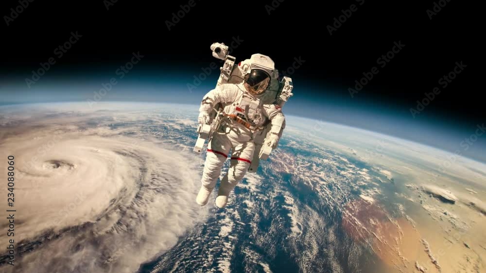 Canvas Prints astronaut in outer space against the backdrop of the planet earth. typhoon over planet earth. elemen