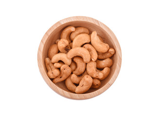 top view of cashew nuts in wooden bowl on white background