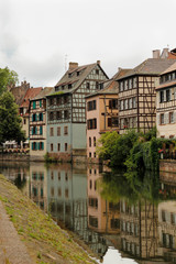 Fototapeta na wymiar Typical euroean midieval town with canal, houses and sidewalk