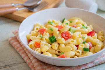 Macaroni salad with elbow pasta and vegetables in bowl