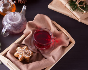 Christmas cookies snowflakes , teapot, cup of tea on the tray