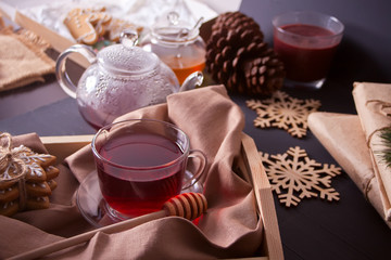Christmas cookies snowflakes , teapot, cup of tea on the tray