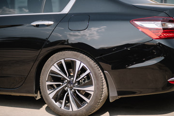 Obraz na płótnie Canvas Black modern car headlights - front view. Black modern car closeup