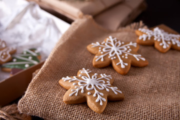 Christmas cookies snowflakes on the wooden table