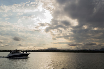 speedboat at sunset