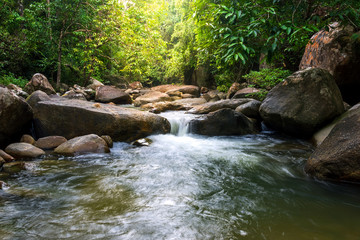 Naklejka na ściany i meble Creek from waterfall, landscape of Namtok Tamot or Namtok Mom Chui located in Tamot Wildlife Protection Unit, Phatthalung province in south of Thailand