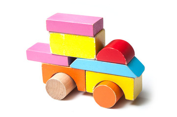 closeup of vehicle on colorful wooden blocks on white background