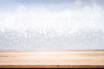 Wooden table with blur bokeh background.
