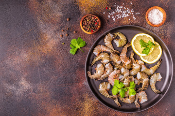 Raw shrimps with parsley and lemon.
