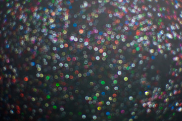 blur of glitter on black background.