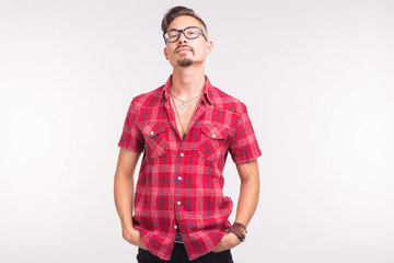 People, beauty and fashion concept - close up portrait young stylish handsome man on white...