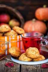 Fresh homemade delicious apple cookies and cup of hot red tea