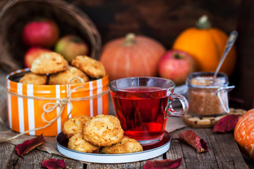 Fresh homemade delicious apple cookies and cup of hot red tea