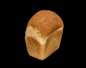 White bread loaf isolated on black background